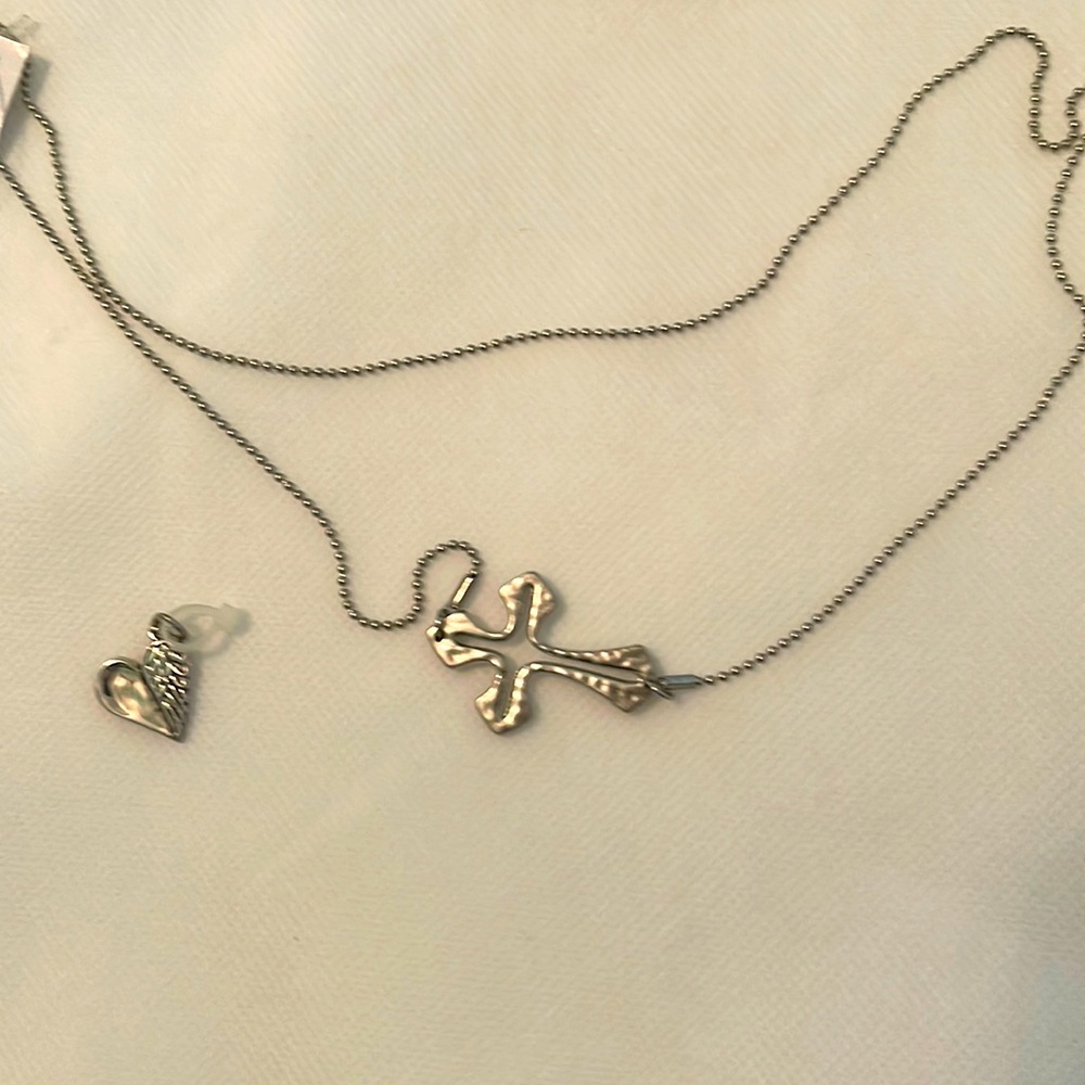 Silver cross necklace with attached heart if you want to add
